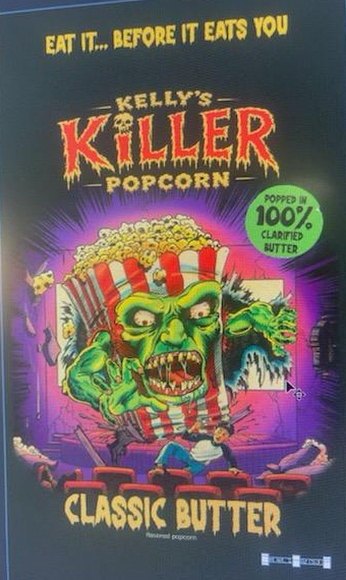 The front of the new Kelly's Killer Popcorn bag: a green monster bursting through a movie screen